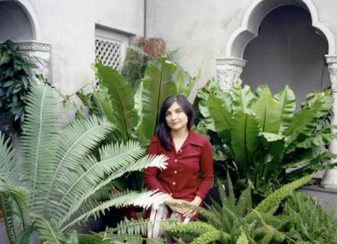 Photo of Sarah Davachi with plants