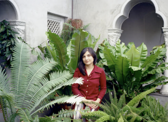 Photo of Sarah Davachi with plants