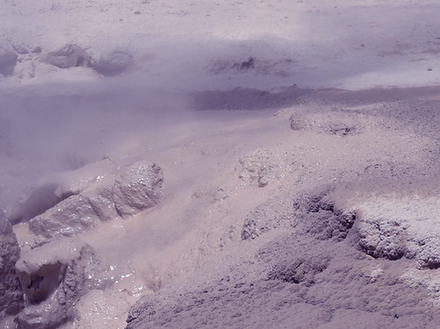 A shot of a desert. The color grading is purplish.
